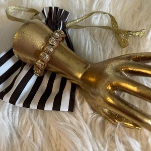 Henri Bendel leather/grommet bracelet.